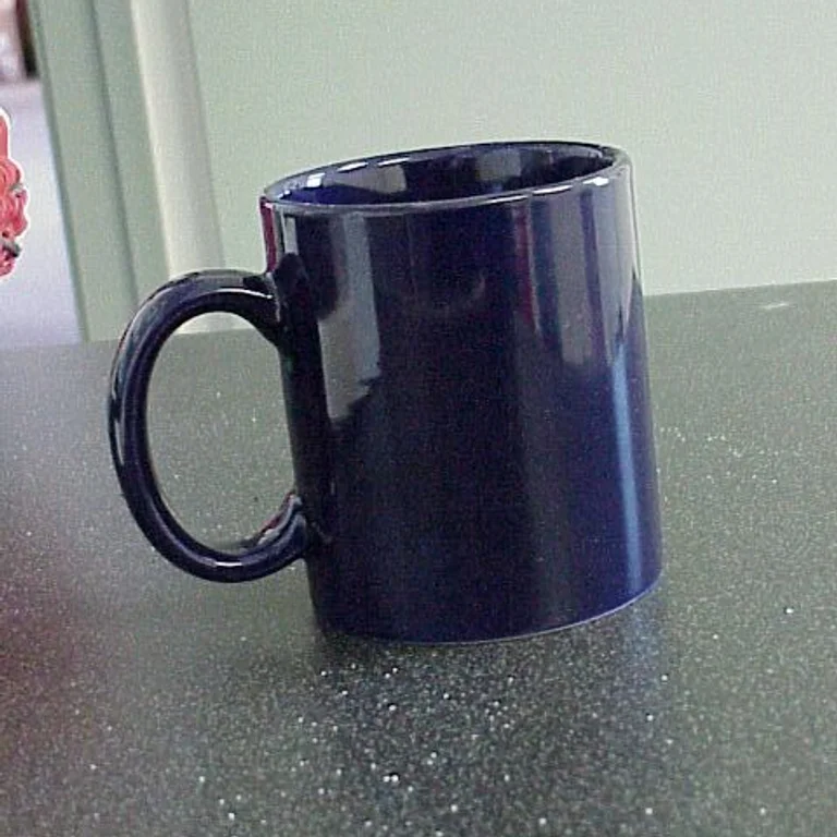 Original photo: a dark blue mug on a speckled kitchen counter